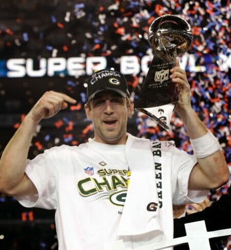 aaron rodgers holding the super bowl trophy