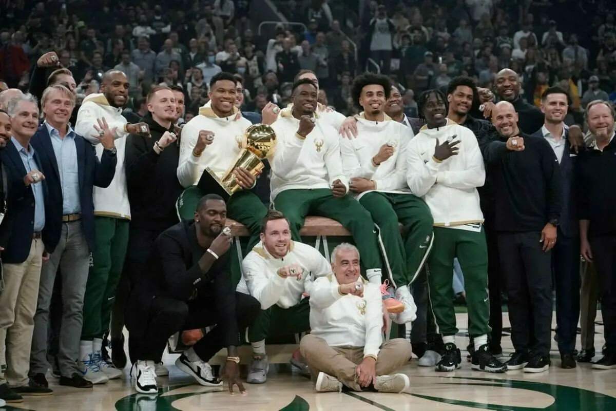 Milwaukee Bucks owners and players display their championship rings before an NBA basketball game between the Bucks and the Brooklyn Nets, Tuesday, Oct. 19, 2021, in Milwaukee. (AP Photo/Morry Gash) (NBA News)
