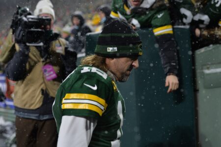 Green Bay Packers quarterback Aaron Rodgers walks off the field after a home loss to the 49ers in the Playoffs