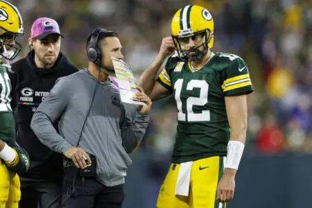 Oct 2, 2022; Green Bay, Wisconsin, USA; Green Bay Packers head coach Matt LaFleur talks with quarterback Aaron Rodgers (12) during overtime against the New England Patriots at Lambeau Field. Mandatory Credit: Jeff Hanisch-USA TODAY Sports (GReen Bay Packers News)