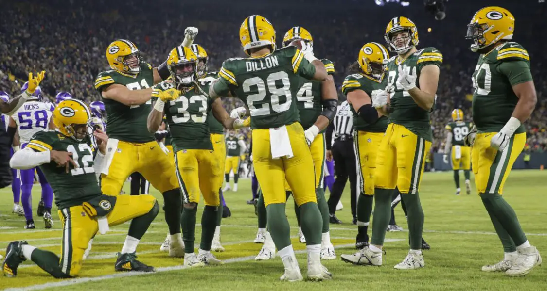 Jan 1, 2023; Green Bay, Wisconsin, USA; Green Bay Packers running back AJ Dillon (28) celebrates with his teammates after scoring a touchdown against the Minnesota Vikings during their game at Lambeau Field. Mandatory Credit: Tork Mason-USA TODAY Sports (NFL News)