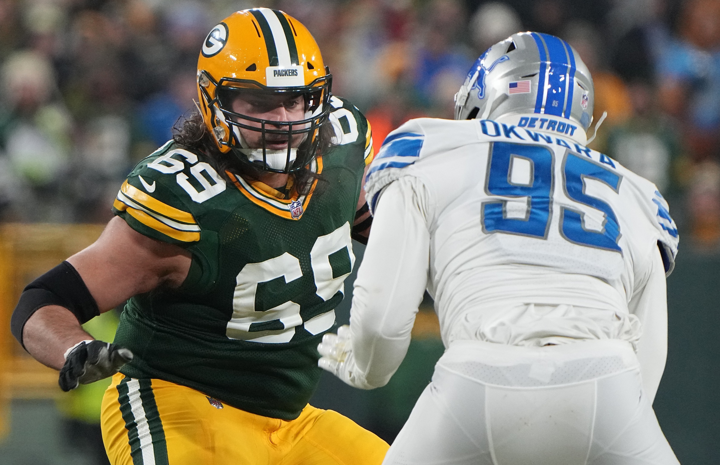 Jan 8, 2023; Green Bay, Wisconsin, USA; Green Bay Packers offensive tackle David Bakhtiari (69) provides pass protection while covering Detroit Lions linebacker Romeo Okwara (95) during the second quarter at Lambeau Field. Mandatory Credit: Mark Hoffman/Milwaukee Journal Sentinel via USA TODAY NETWORK (NFL News)