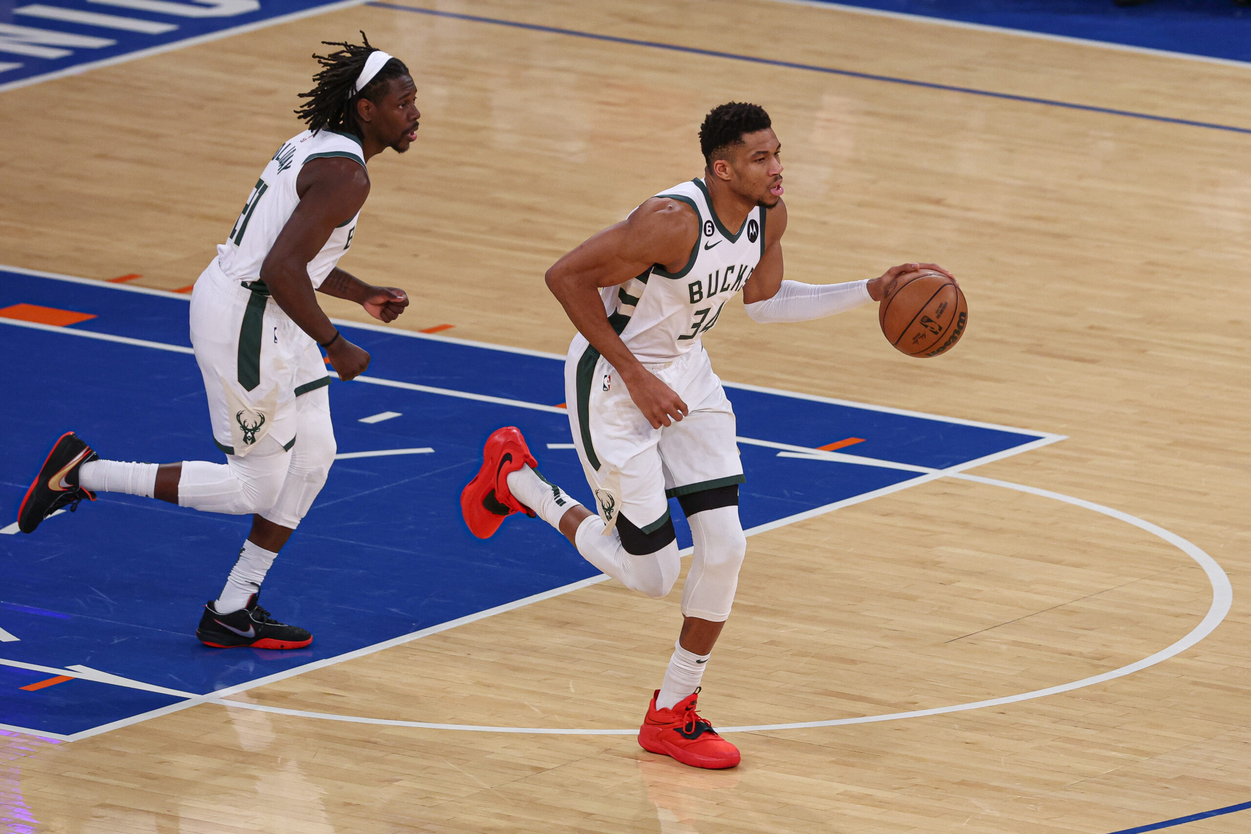 Jan 9, 2023; New York, New York, USA; Milwaukee Bucks forward Giannis Antetokounmpo (34) dribbles up court in front of guard Jrue Holiday (21) during the first quarter against the New York Knicks at Madison Square Garden. Mandatory Credit: Vincent Carchietta-USA TODAY Sports (NBA News)