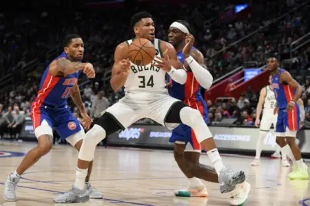 Jan 23, 2023; Detroit, Michigan, USA; Milwaukee Bucks forward Giannis Antetokounmpo's (34) drives to the basket against Detroit Pistons guard Rodney McGruder (17) (left) and center Jalen Duran (0) in the third quarter at Little Caesars Arena. Mandatory Credit: Lon Horwedel-USA TODAY Sports (NBA news)