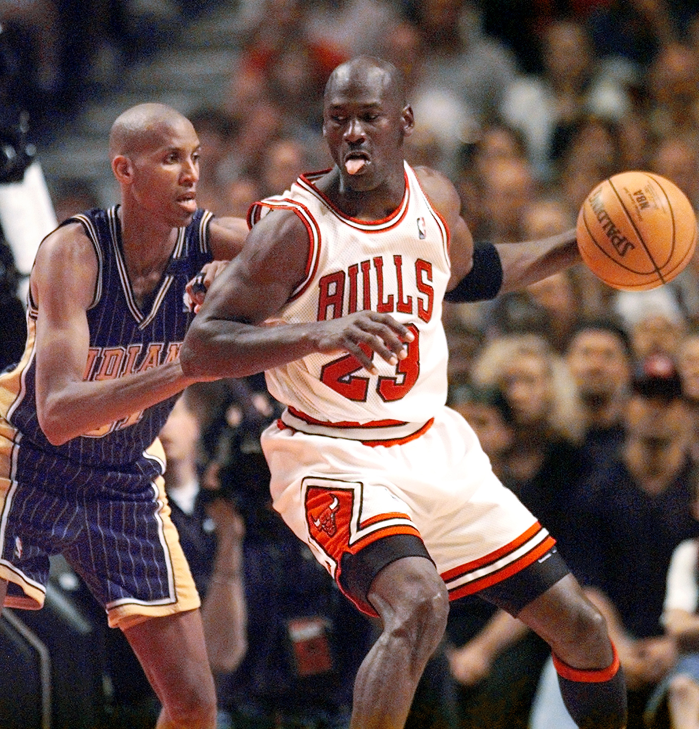 May 31, 1998; Chicago, IL, USA; Chicago Bulls guard Michael Jordan (23), right, is guarded by Indiana Pacers player Reggie Miller (31) in the second half at the United Center. Mandatory Credit: Anne Ryan-USA TODAY (NBA News)