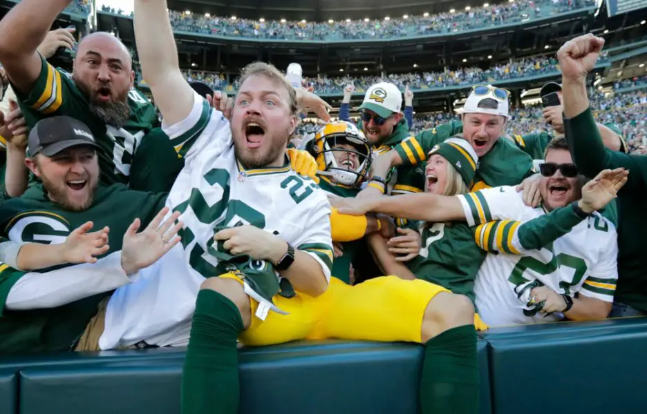 Green Bay Packers wide receiver Christian Watson (9) celebrates scoring a touchdown against the New England Patriots with fans in the second quarter during their football game Sunday, October 2, at Lambeau Field in Green Bay, Wis. Dan Powers/USA TODAY NETWORK-Wisconsin (NFL News)