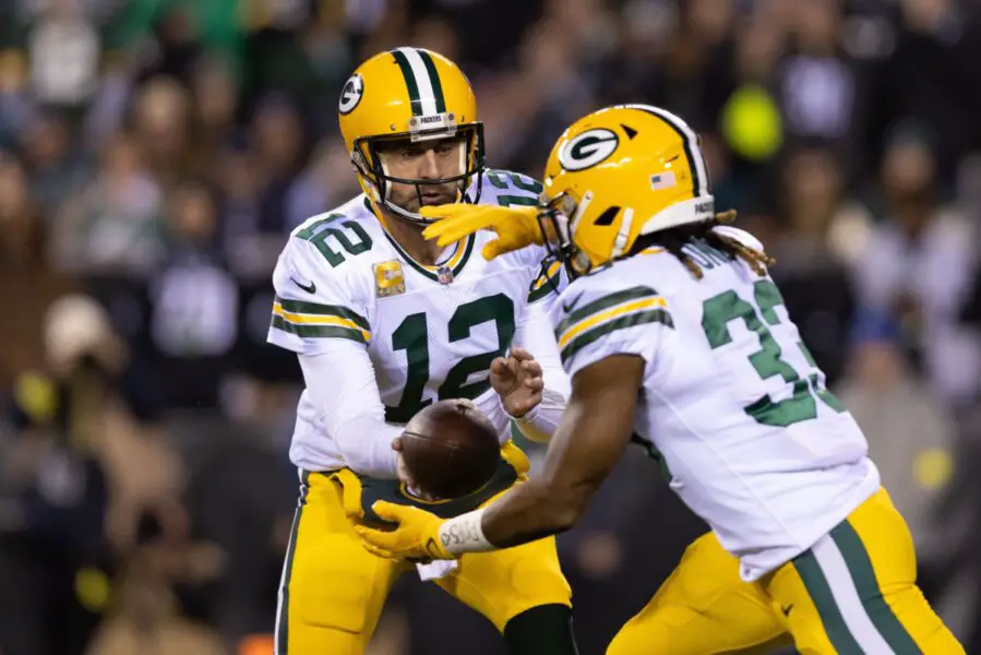 Nov 27, 2022; Philadelphia, Pennsylvania, USA; Green Bay Packers quarterback Aaron Rodgers (12) hands off to running back Aaron Jones (33) against the Philadelphia Eagles during the first quarter at Lincoln Financial Field. Mandatory Credit: Bill Streicher-USA TODAY Sports