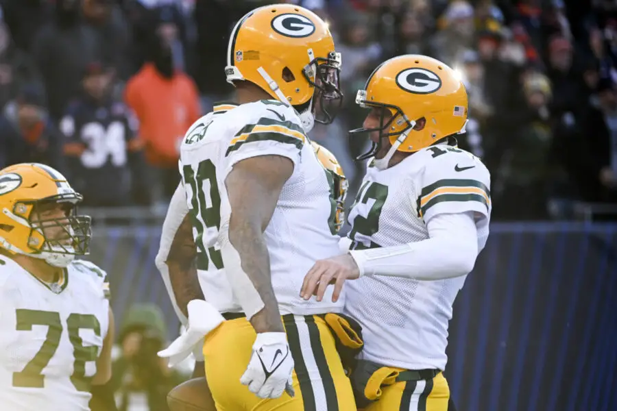 Dec 4, 2022; Chicago, Illinois, USA; Green Bay Packers tight end Marcedes Lewis (89) celebrates with quarterback Aaron Rodgers (12) after Lewis scored a touchdown against the Chicago Bears during the second half at Soldier Field. Mandatory Credit: Matt Marton-USA TODAY Sports