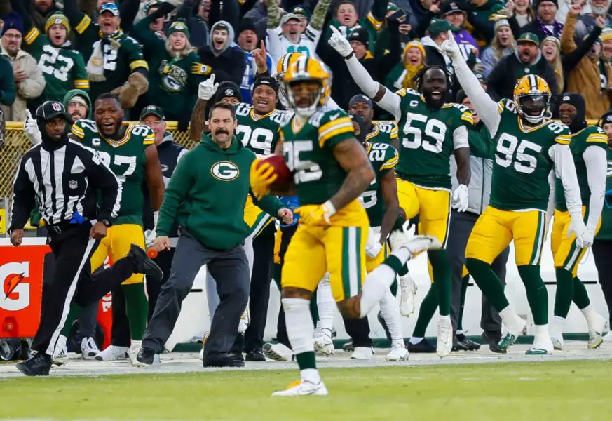 The Green Bay Packers bench celebrates as Green Bay Packers cornerback Keisean Nixon (25) returns a kickoff for a touchdown against the Minnesota Vikings on Sunday, January 1, 2023, at Lambeau Field in Green Bay, Wis. Apj Packers Vs Vikings 010123 129 Ttm (NFL News)