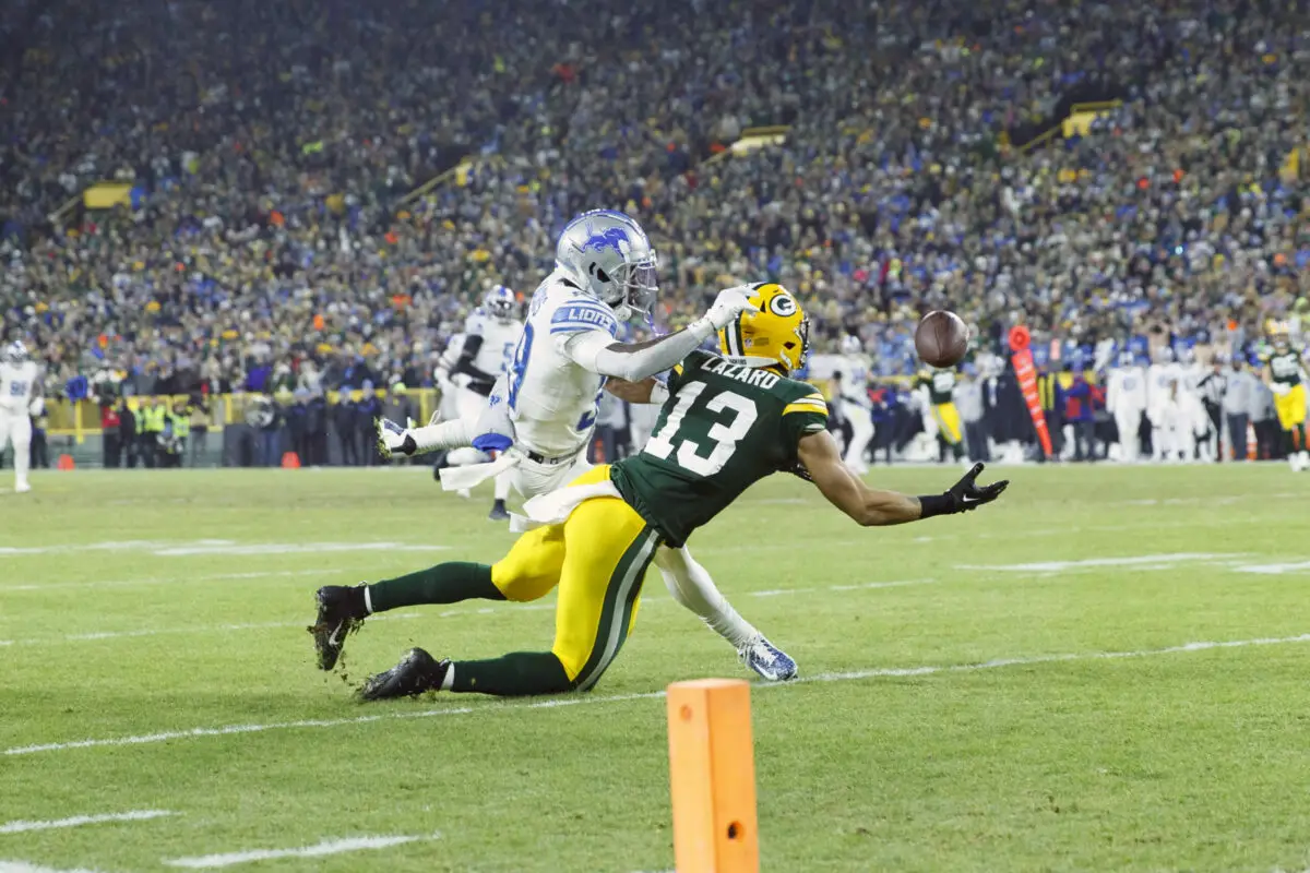 Jan 8, 2023; Green Bay, Wisconsin, USA; Green Bay Packers wide receiver Allen Lazard (13) tries to catch a pass during the first quarter against the Detroit Lions at Lambeau Field. Mandatory Credit: Jeff Hanisch-USA TODAY Sports