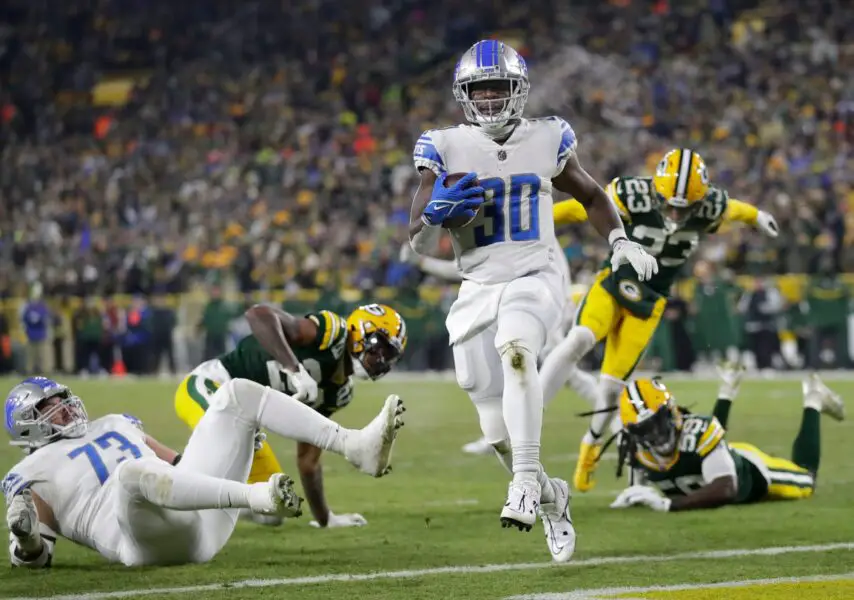 Detroit Lions running back Jamaal Williams scores against the Green Bay Packers.
