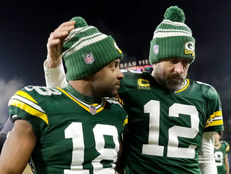 Green Bay Packers quarterback Aaron Rodgers (12) and wide receiver Randall Cobb (18) leave the field after losing to the Detroit Lions 20-16 during their football game on Sunday, January, 8, 2023 at Lambeau Field in Green Bay, Wis. Wm. Glasheen USA TODAY NETWORK-Wisconsin Apc Packers Vs Lions 5319 010823 Wag (Packers News, NFL News)