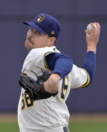 Milwaukee Brewers pitcher Janson Junk delivers a ball in a spring training game