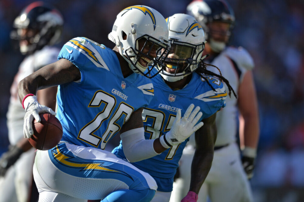Oct 22, 2017; Carson, CA, USA; Los Angeles Chargers cornerback Casey Hayward (26) reacts after an interception with teammate strong safety Jahleel Addae (37) during the second half against the Denver Broncos at StubHub Center. Mandatory Credit: Orlando Ramirez-USA TODAY Sports - Green Bay Packers