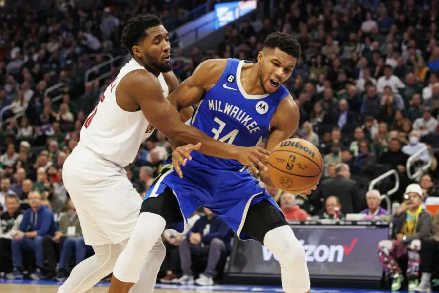 Nov 16, 2022; Milwaukee, Wisconsin, USA; Cleveland Cavaliers guard Donovan Mitchell (45) fouls Milwaukee Bucks forward Giannis Antetokounmpo (34) during the second quarter at Fiserv Forum. Mandatory Credit: Jeff Hanisch-USA TODAY Sports (NBA News)