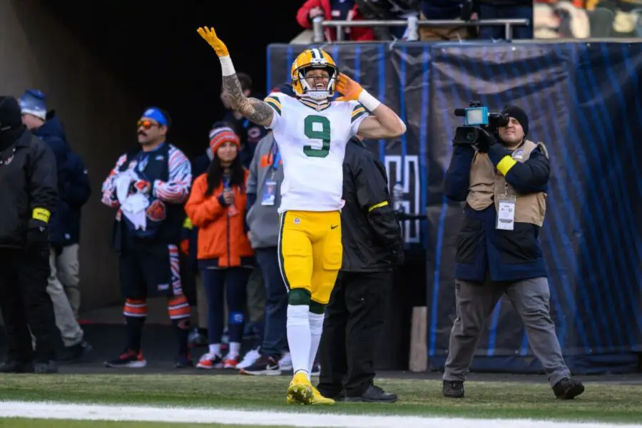 Dec 4, 2022; Chicago, Illinois, USA; Green Bay Packers wide receiver Christian Watson (9) celebrates his rushing touchdown in the fourth quarter against the Chicago Bears at Soldier Field. Mandatory Credit: Daniel Bartel-USA TODAY Sports