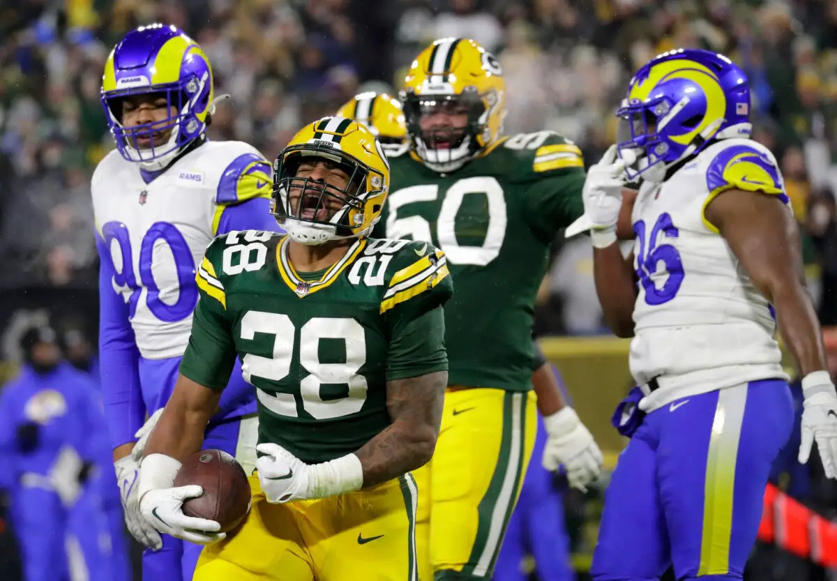 Green Bay Packers running back AJ Dillon (28) celebrates after scoring a touchdown against the Los Angeles Rams in the third quarter during their football game Monday, December 19, at Lambeau Field in Green Bay, Wis. Dan Powers/USA TODAY NETWORK-Wisconsin Apc Packersvsrams 1219221411djp