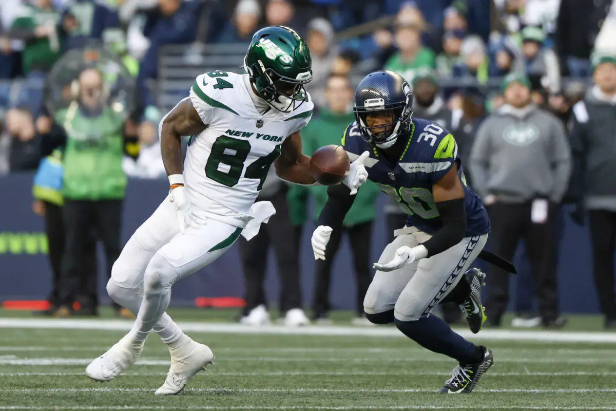 Jan 1, 2023; Seattle, Washington, USA; New York Jets wide receiver Corey Davis (84) catches a pass against Seattle Seahawks cornerback Mike Jackson (30) during the fourth quarter at Lumen Field. Mandatory Credit: Joe Nicholson-USA TODAY Sports (NFL - Aaron Rodgers)