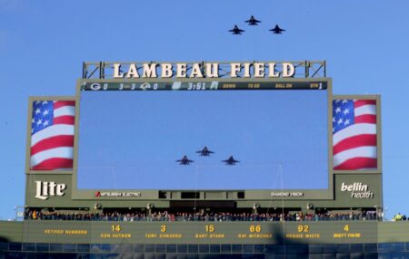 The flyover above a Lambeau Field videoboard before the Green Bay Packers game against the Los Angeles Rams at Lambeau Field on Nov. 28, 2021, in Green Bay, Wis. Packers Rams National Anthem 13 (NFL News)