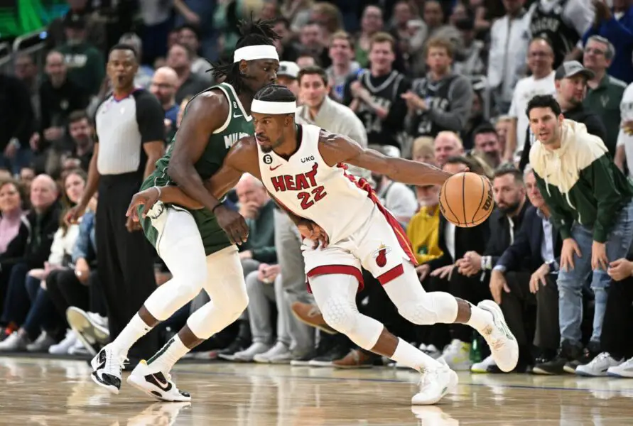 Milwaukee Bucks guard Jrue Holiday defends Miami Heat star Jimmy Butler (NBA News)