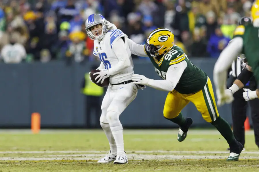 Jan 8, 2023; Green Bay, Wisconsin, USA; Detroit Lions quarterback Jared Goff (16) is sacked by Green Bay Packers defensive lineman Devonte Wyatt (95) during the second quarter at Lambeau Field. Mandatory Credit: Jeff Hanisch-USA TODAY Sports (NFL)