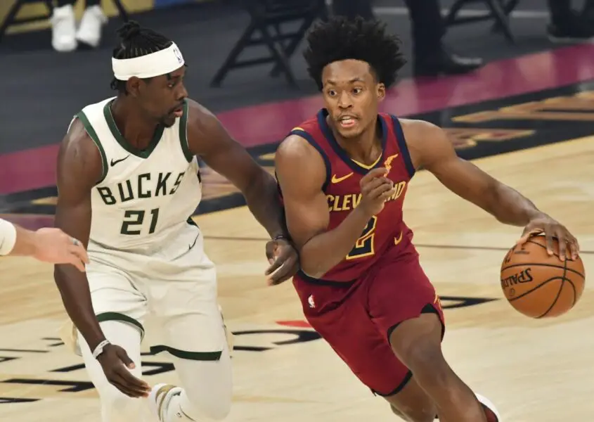 Feb 5, 2021; Cleveland, Ohio, USA;  Cleveland Cavaliers guard Collin Sexton (2) drives to the basket against Milwaukee Bucks guard Jrue Holiday (21) during the first quarter at Rocket Mortgage FieldHouse. Mandatory Credit: Ken Blaze-USA TODAY Sports