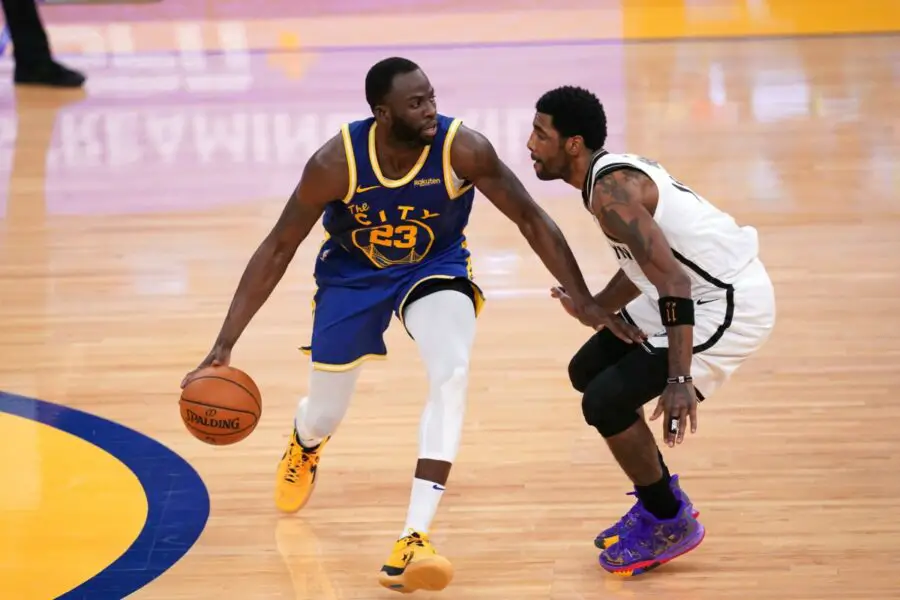 Feb 13, 2021; San Francisco, California, USA; Golden State Warriors forward Draymond Green (23) dribbles the ball against Brooklyn Nets guard Kyrie Irving (11) in the third quarter at the Chase Center. Mandatory Credit: Cary Edmondson-USA TODAY Sports (NBA News - Bucks)