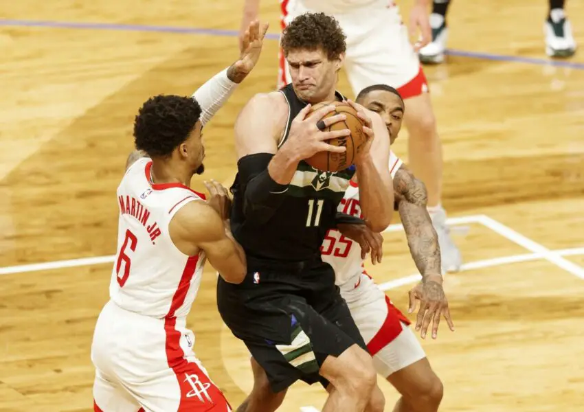 May 7, 2021; Milwaukee, Wisconsin, USA; Milwaukee Bucks center Brook Lopez (11) controls the ball while defended by from Houston Rockets forward Kenyon Martin Jr. (6) and guard DaQuan Jeffries (55) during the third quarter at Fiserv Forum. Mandatory Credit: Jeff Hanisch-USA TODAY Sports NBA Rumors