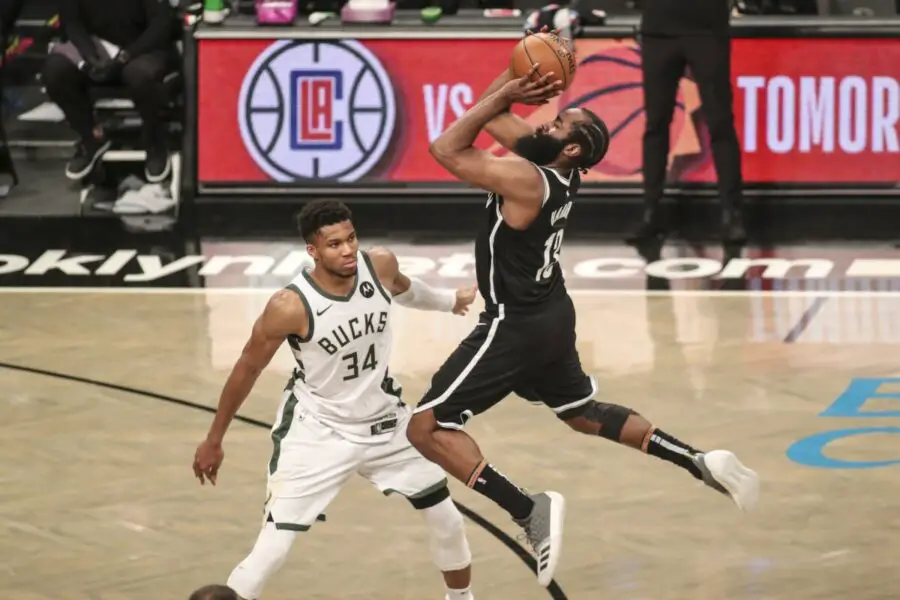 Jun 19, 2021; Brooklyn, New York, USA; Brooklyn Nets guard James Harden (13) shoots an off balanced shot over Milwaukee Bucks forward Giannis Antetokounmpo (34) in overtime during game seven in the second round of the 2021 NBA Playoffs at Barclays Center. Mandatory Credit: Wendell Cruz-USA TODAY Sports NBA Rumors