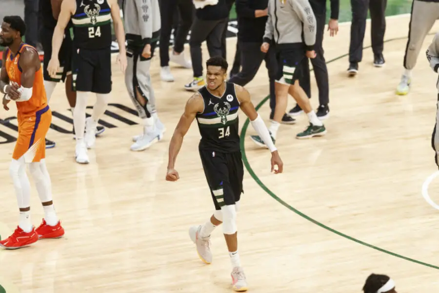 Jul 20, 2021; Milwaukee, Wisconsin, USA; Milwaukee Bucks forward Giannis Antetokounmpo (34) begins to celebrate during the fourth quarter against the Phoenix Suns during game six of the 2021 NBA Finals at Fiserv Forum. Mandatory Credit: Jeff Hanisch-USA TODAY Sports