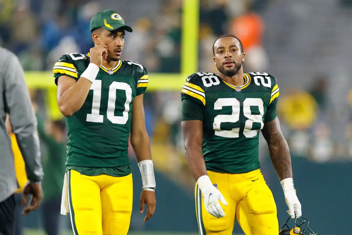 Sep 20, 2021; Green Bay, Wisconsin, USA; Green Bay Packers quarterback Jordan Love (10) and running back AJ Dillon (28) following the game against the Detroit Lions at Lambeau Field. Mandatory Credit: Jeff Hanisch-USA TODAY Sports