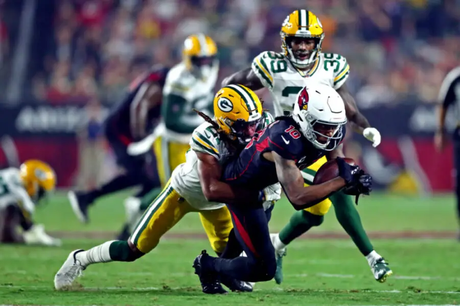 Oct 28, 2021; Glendale, Arizona, USA; Arizona Cardinals wide receiver DeAndre Hopkins (10) is tackled by Green Bay Packers cornerback Eric Stokes (21) during the second half at State Farm Stadium. Mandatory Credit: Mark J. Rebilas-USA TODAY Sports (NFL News)