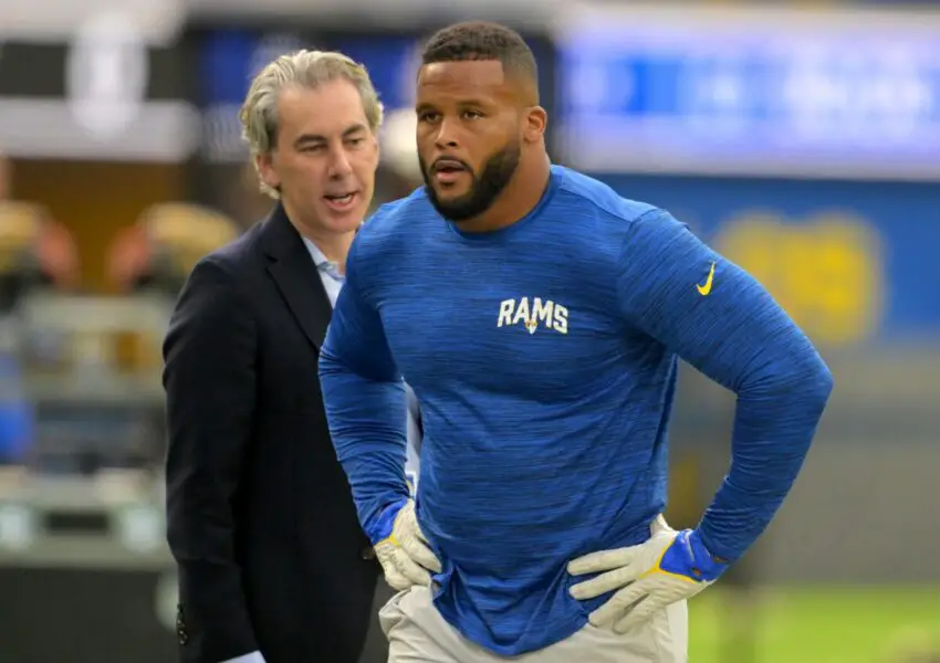 Sep 18, 2022; Inglewood, California, USA; Los Angeles Rams Chief Operating Officer Kevin Demoff talks with defensive tackle Aaron Donald (99) before the game against the Atlanta Falcons at SoFi Stadium. Mandatory Credit: Jayne Kamin-Oncea-USA TODAY Sports (NFL)