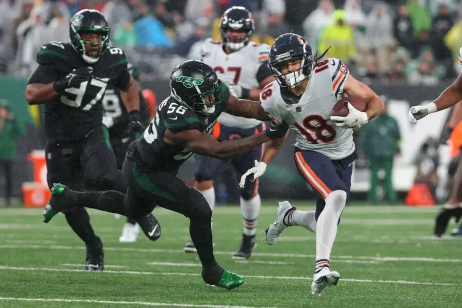 Nov 27, 2022; East Rutherford, New Jersey, USA; Chicago Bears wide receiver Dante Pettis (18) runs with the ball while New York Jets linebacker Quincy Williams (56) attempts to tackle him during the second half at MetLife Stadium. Mandatory Credit: Ed Mulholland-USA TODAY Sports - Green Bay Packers NFL