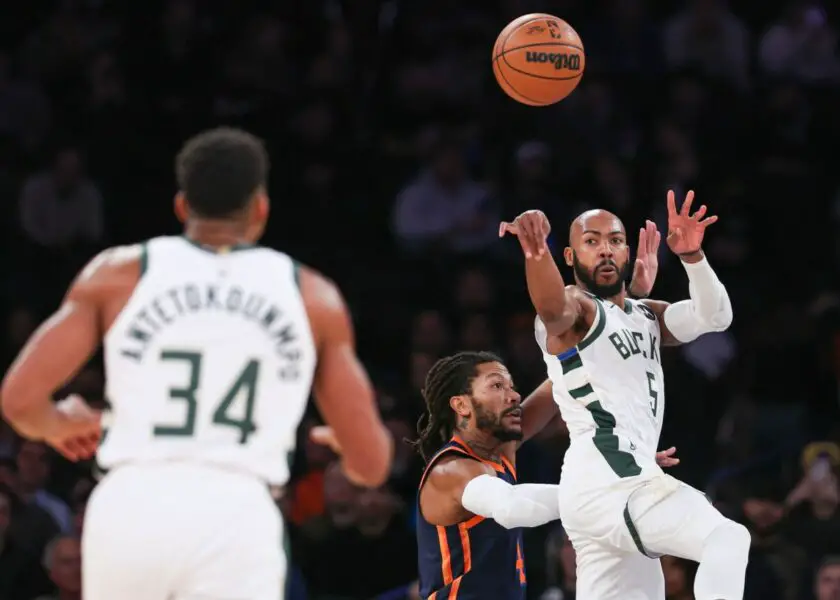 Nov 30, 2022; New York, New York, USA; Milwaukee Bucks guard Jevon Carter (5) passes the ball to forward Giannis Antetokounmpo (34) as New York Knicks guard Derrick Rose (4) defends during the first quarter at Madison Square Garden. Mandatory Credit: Vincent Carchietta-USA TODAY Sports (NBA Rumors)