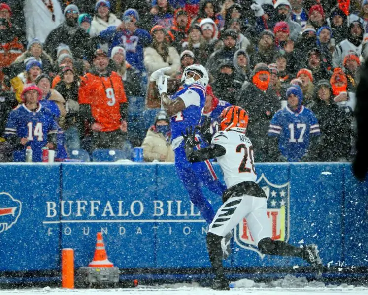 Jan 22, 2023; Orchard Park, New York, USA; Buffalo Bills wide receiver Stefon Diggs (14) makes a catch while defended by Cincinnati Bengals cornerback Eli Apple (20) during the third quarter of an AFC divisional round game at Highmark Stadium. Mandatory Credit: Gregory Fisher-USA TODAY Sports (NFL News)