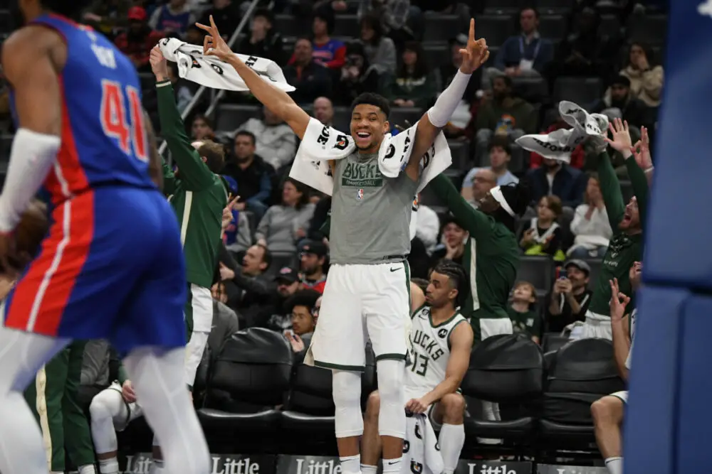 Jan 23, 2023; Detroit, Michigan, USA; Milwaukee Bucks forward Giannis Antetokounmpo (34) reacts from the bench after guard AJ Green (not pictured) made a basket against the Detroit Pistons in the fourth quarter at Little Caesars Arena. Mandatory Credit: Lon Horwedel-USA TODAY Sports (NBA Rumors)