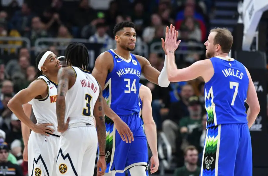 Jan 25, 2023; Milwaukee, Wisconsin, USA; Milwaukee Bucks forward Giannis Antetokounmpo (34) high-fives guard Joe Ingles (7) after being fouled by a the Denver Nuggets player in the second half at Fiserv Forum. Mandatory Credit: Michael McLoone-USA TODAY Sports (NBA Rumors)