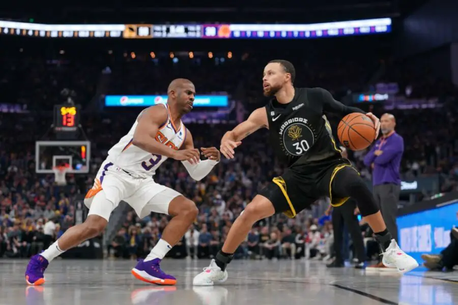 Mar 13, 2023; San Francisco, California, USA; Golden State Warriors guard Stephen Curry (30) dribbles the ball next to Phoenix Suns guard Chris Paul (3) in the second quarter at the Chase Center. Mandatory Credit: Cary Edmondson-USA TODAY Sports
