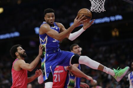 Apr 4, 2023; Washington, District of Columbia, USA; Milwaukee Bucks forward Giannis Antetokounmpo (34) rebounds the ball over Washington Wizards forward Anthony Gill (16) in the first quarter at Capital One Arena. Mandatory Credit: Geoff Burke-USA TODAY Sports (NBA News)