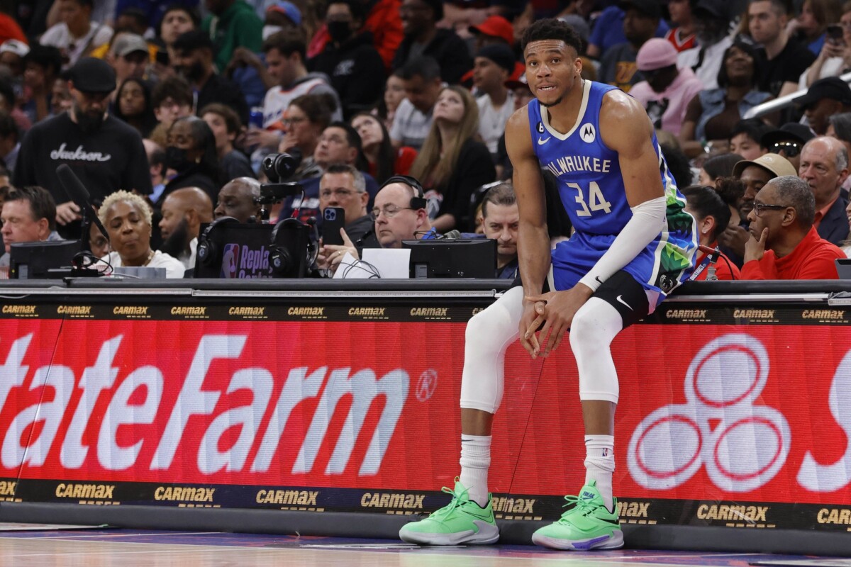 Apr 4, 2023; Washington, District of Columbia, USA; Milwaukee Bucks forward Giannis Antetokounmpo (34) sits on the scorers table against the Washington Wizards in the fourth quarter at Capital One Arena. Mandatory Credit: Geoff Burke-USA TODAY Sports