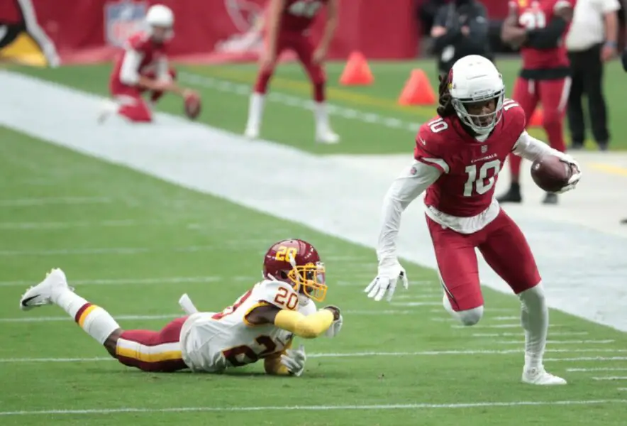 Arizona Cardinals wide receiver DeAndre Hopkins (10) breaks a tackle by Washington Football Team cornerback Jimmy Moreland (20) after a catch during the first quarter at State Farm Stadium in Glendale on Sept. 20, 2020.