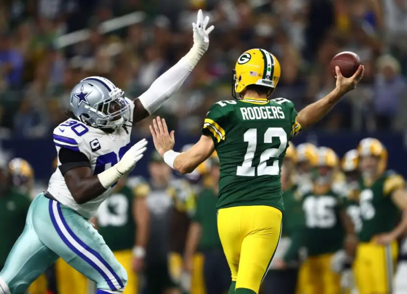 Oct 6, 2019; Arlington, TX, USA; Green Bay Packers quarterback Aaron Rodgers (12) throws under pressure from Dallas Cowboys defensive end DeMarcus Lawrence (90) in the fourth quarter at AT&T Stadium. Mandatory Credit: Matthew Emmons-USA TODAY Sports (NFL News)