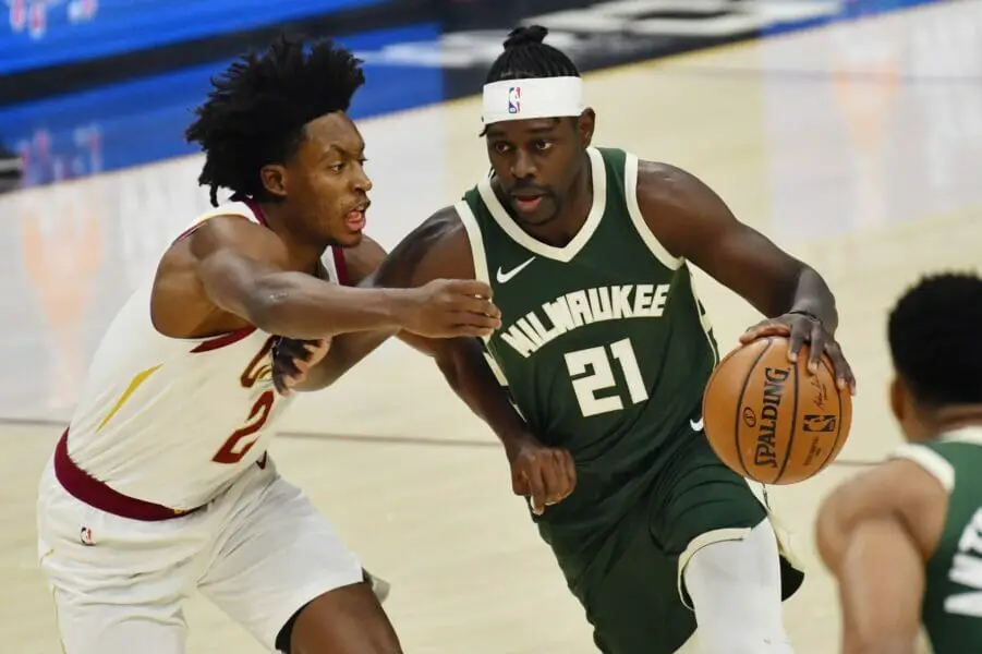 Feb 6, 2021; Cleveland, Ohio, USA; Milwaukee Bucks guard Jrue Holiday (21) drives to the basket against Cleveland Cavaliers guard Collin Sexton (2) during the first quarter at Rocket Mortgage FieldHouse. Mandatory Credit: Ken Blaze-USA TODAY Sports (NBA Rumors)
