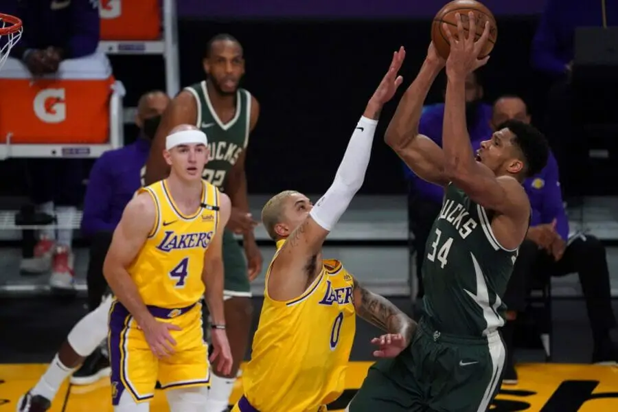 Mar 31, 2021; Los Angeles, California, USA; Milwaukee Bucks forward Giannis Antetokounmpo (34) shoots the ball while defended by Los Angeles Lakers forward Kyle Kuzma (0) during the first half at Staples Center. Mandatory Credit: Kirby Lee-USA TODAY Sports (NBA News)