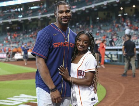 Apr 18, 2022; Houston, Texas, USA; Olympic gold medalist gymnast Simone Biles and Houston Texans defensive back Jonathan Owens pose for a picture before the game between the Houston Astros and the Los Angeles Angels at Minute Maid Park. Mandatory Credit: Troy Taormina-USA TODAY Sports (NFL News - Packers)