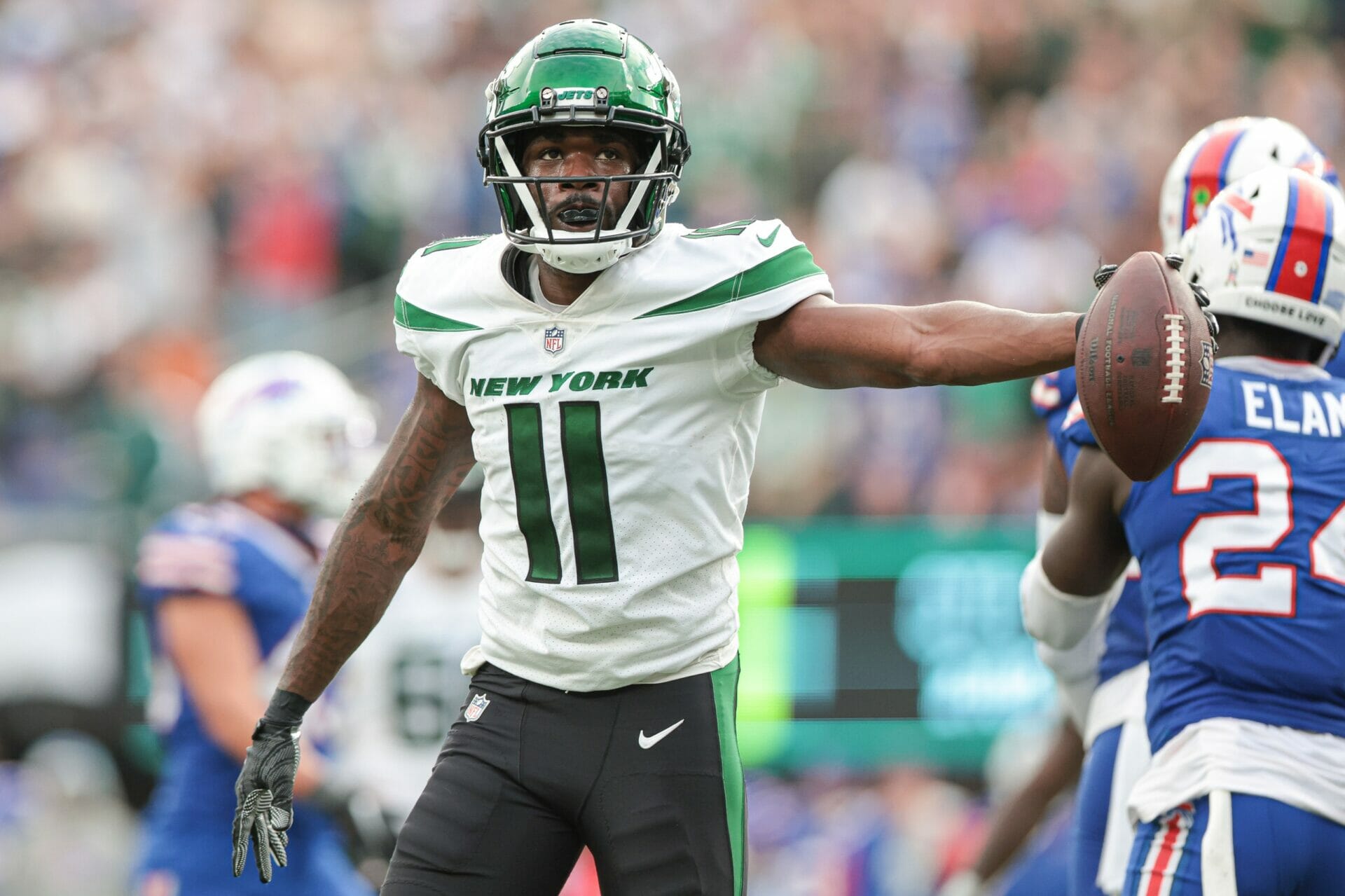 Nov 6, 2022; East Rutherford, New Jersey, USA; New York Jets wide receiver Denzel Mims (11) reacts after making a catch during the fourth quarter against the Buffalo Bills at MetLife Stadium. Mandatory Credit: Vincent Carchietta-USA TODAY Sports (NFL)