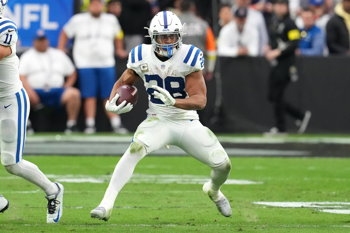Nov 13, 2022; Paradise, Nevada, USA; Indianapolis Colts running back Jonathan Taylor (28) gains yardage against the Las Vegas Raiders during the first half at Allegiant Stadium. Mandatory Credit: Stephen R. Sylvanie-USA TODAY Sports (Green Bay Packers)