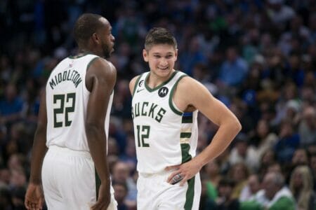 Dec 9, 2022; Dallas, Texas, USA; Milwaukee Bucks forward Khris Middleton (22) and guard Grayson Allen (12) smile during the second half against the Dallas Mavericks at the American Airlines Center. Mandatory Credit: Jerome Miron-USA TODAY Sports (NBA News)