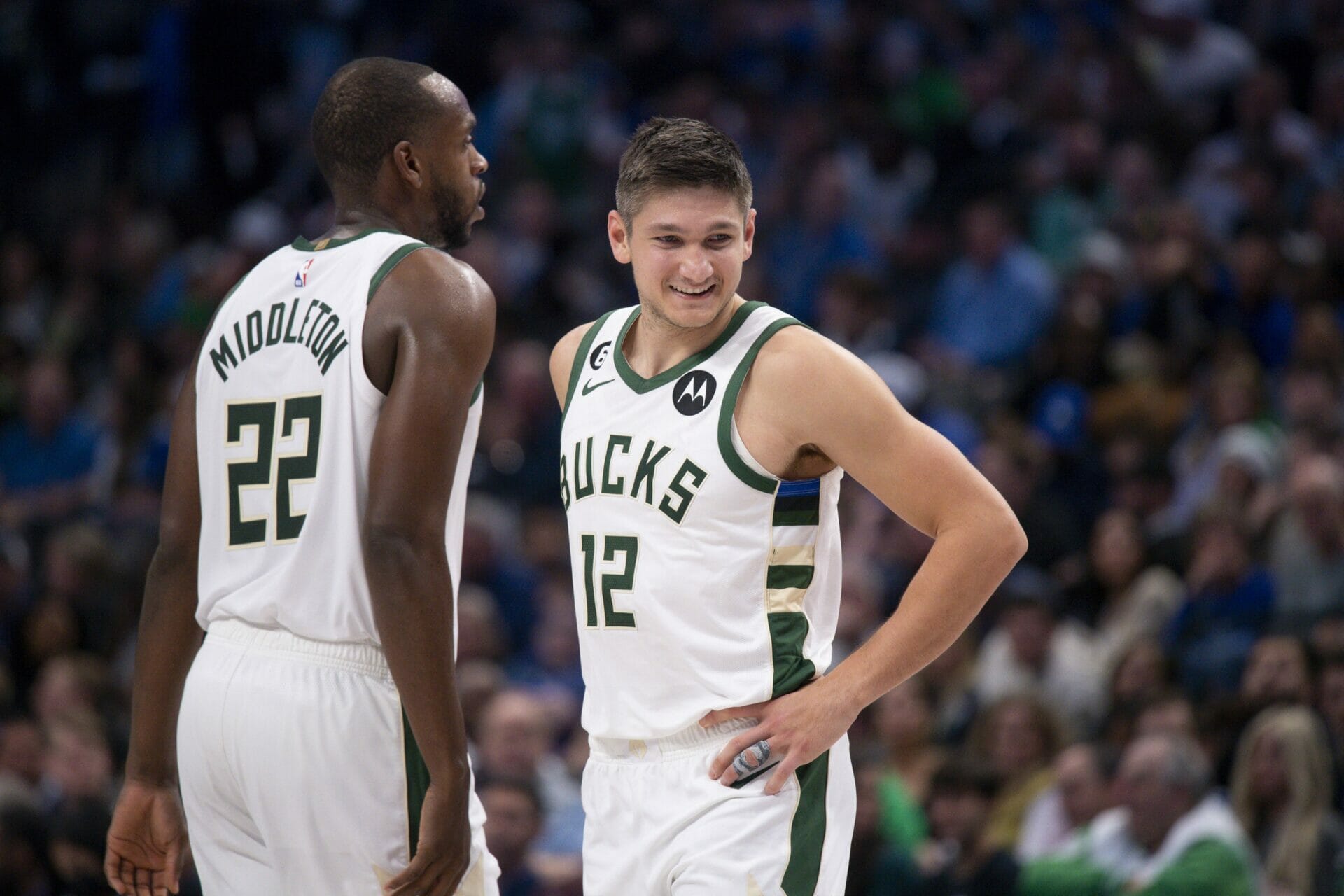 Dec 9, 2022; Dallas, Texas, USA; Milwaukee Bucks forward Khris Middleton (22) and guard Grayson Allen (12) smile during the second half against the Dallas Mavericks at the American Airlines Center. Mandatory Credit: Jerome Miron-USA TODAY Sports (NBA News)